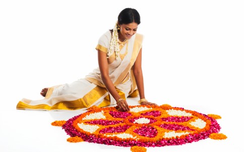 Indian woman with Rangoli of Flowers
